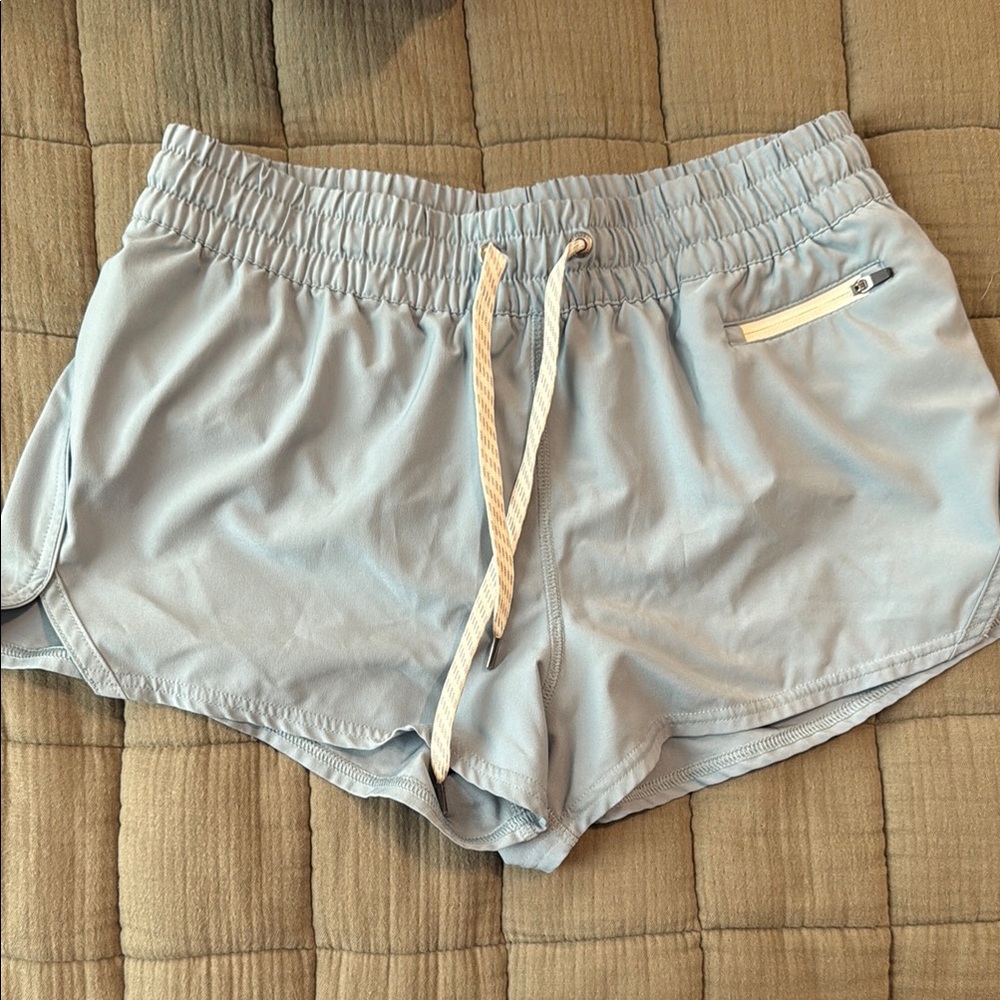 Vuori Blue Athletic Shorts with Relaxed Fit and Curved Hem